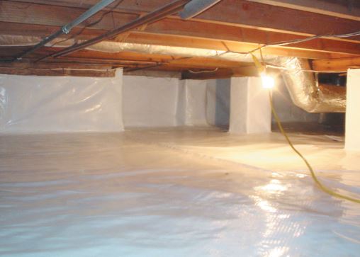 A crawl space fully encapsulated in a white waterproofing material